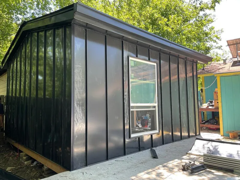 Black standing seam metal wall panels for Roof Inspection in Greenwood